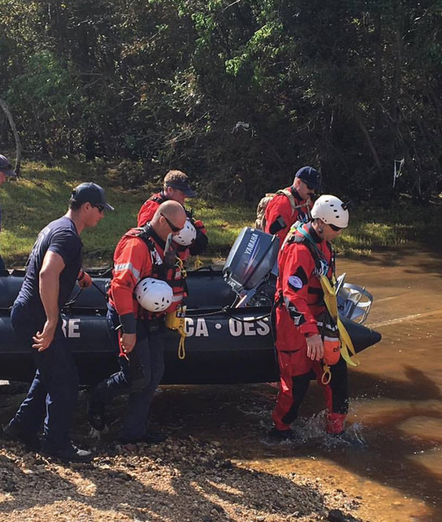 (3) Cal OES Swiftwater/Flood Search & Rescue Team 10 (Ventura County Fire Department) launching a motorized inflatable rescue boat for search and rescue operations near Lumberton, Texas. (Photo courtesy of the Ventura County Fire Department.)