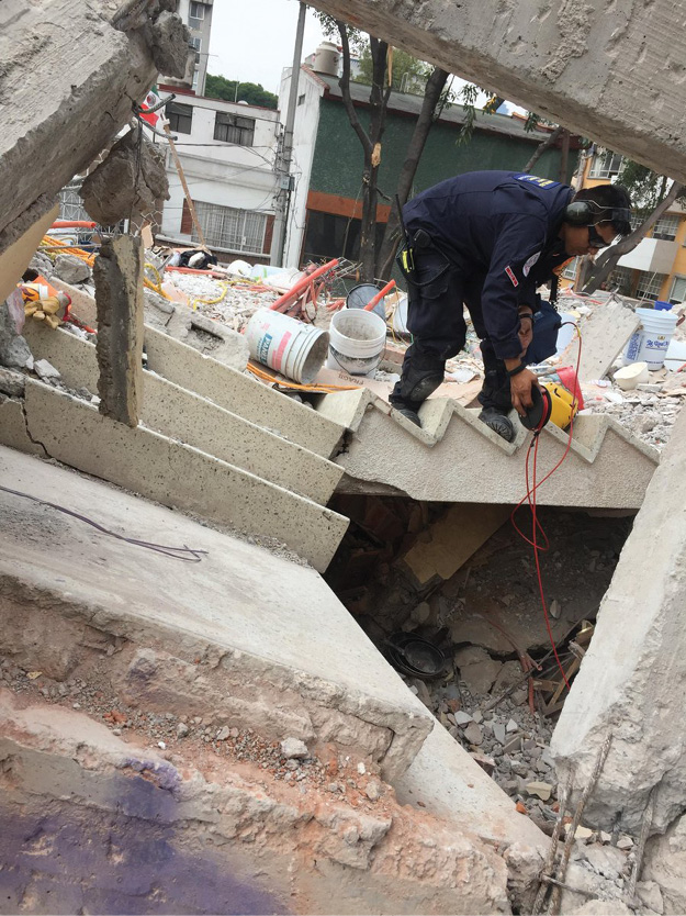 (7) USA-2 members from the L.A. County Fire Department conducting technical search operations at a large collapsed building in Mexico City. (Photo courtesy of the L.A. County Fire Department.)