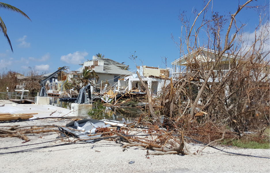 (1) Damaged homes in Big Pine Key, Florida. (Photos courtesy of the FDNY IMT public information officer. )