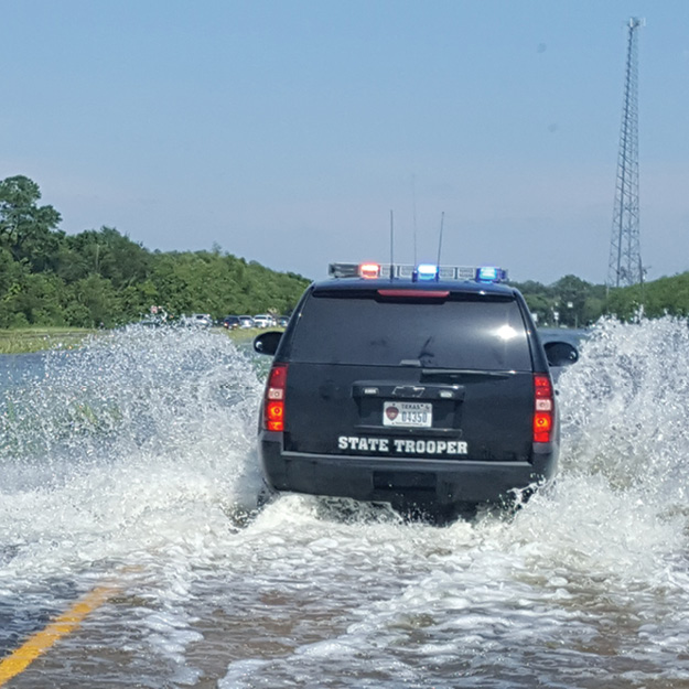 (7) Texas State Police escorts a convoy of supplies to Beaumont, Texas.