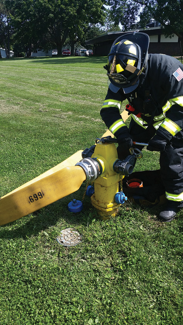 (6) The firefighter “fully taps” the hydrant, first using the steamer connection. Using the two gate valves will make it possible to ultimately flow at hydrant capacity or augment additional responding engines, if needed.