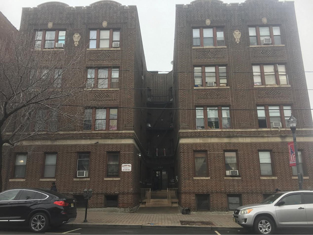 (3) Notice the throat (center) of this E-shaped building. Positioning the platform of the tower ladder in line with the throat will allow the bucket to cover multiple wings of the building.