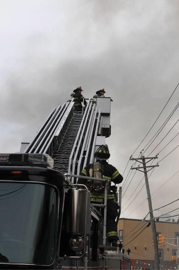 (5) The firefighter positioned at the turntable serves as a “lookout” for the firefighters operating in the bucket. This firefighter can override the controls from the turntable. (Photo by Ron Jeffers.)