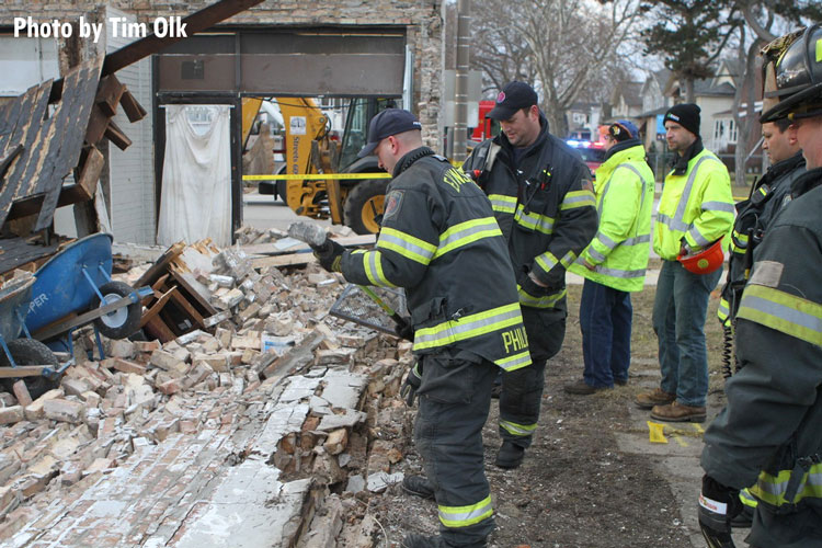 Firefighters at building collapse