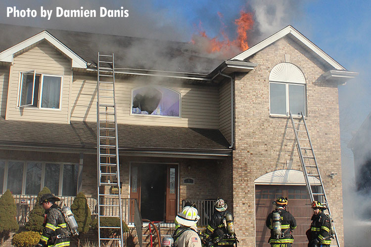 Fire vents from the roof of a home