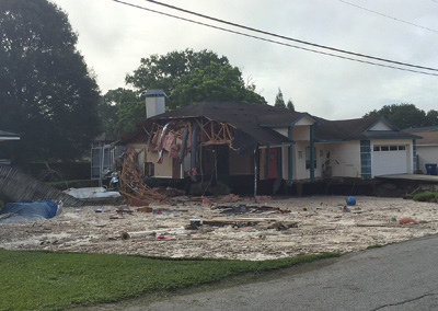 (1) Just after firefighters had evacuated, the first house suffered a partial structural collapse. (Photos by author.)