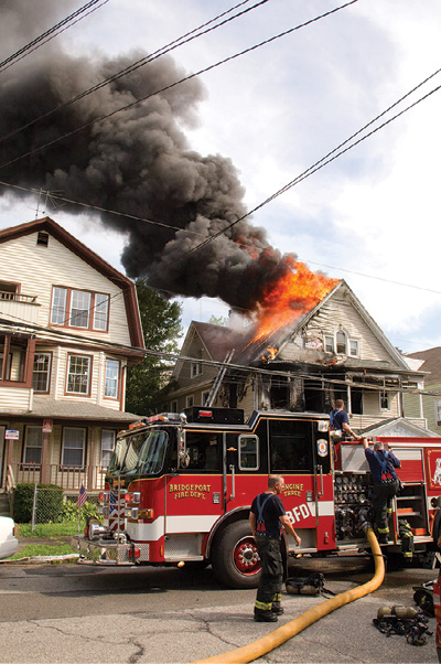 (12) Two Bridgeport, Connecticut, firefighters died as a result of this attic fire. (Photo by Keith Muratori.)