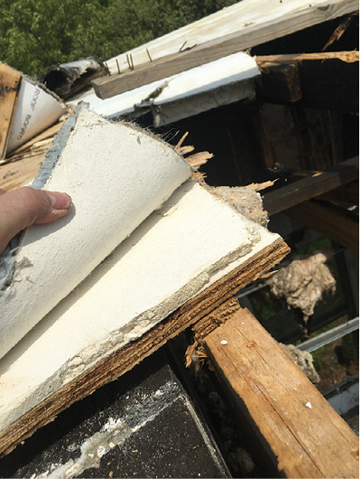 (8) The composition of the roofing material was unknown; responders had no access to approved building plans. When roofing was cut, it tended to resist heat and gum up saw blades. (Photo by Jerry Fokas.)