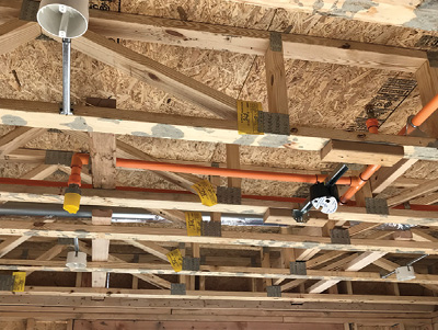 (7) This lightweight wood-frame multiple dwelling has sprinklers above and below the ceiling, complying with NFPA 13. NFPA 13 systems are not common in these structures; most are NFPA 13R systems.