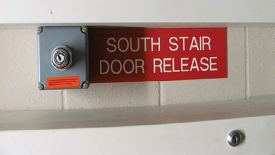 (11) The key switch in the fire command room unlocks stairwell doors, allowing occupants to exit stairs on floors above the ground-floor exit. 