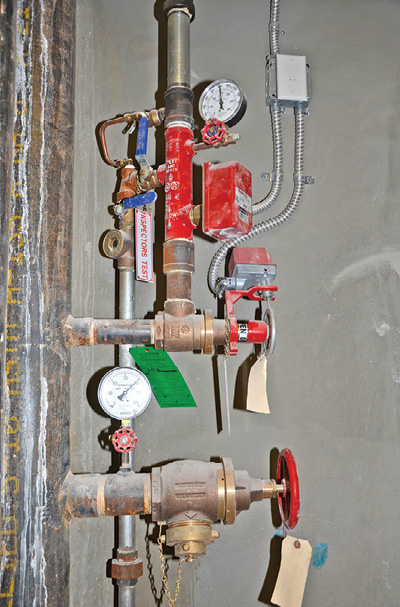 (3) To properly shut off the flow to the sprinklers supplied by a combination sprinkler/standpipe system, close the floor isolation valve above the hose outlet, and operate the test/drain valves (blue handles) to divert water remaining in the sprinkler piping to the one-inch drain riser.