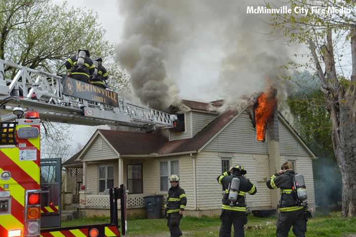 Firefighters battle a house fire