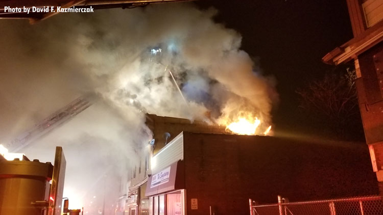 Elevated master stream in use at structure fire