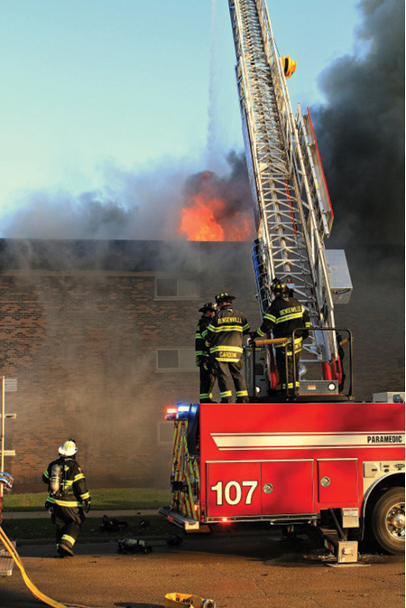 (4) The fire has control of the cockloft and is burning through the roof. We needed more tower ladders or elevated master streams at this fire. 