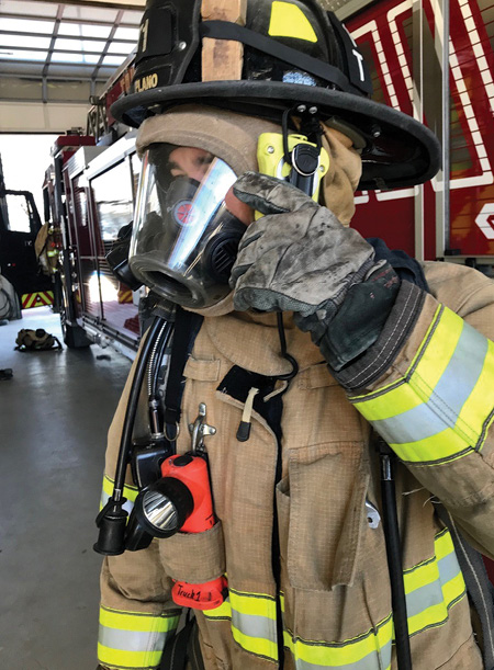 (6) Shown is a method of attaching the remote speaker mic to the helmet by an elastic loop. The loop holds the mic in place, making it easier to hear communications and reduce the likelihood of missing critical transmissions. It also is easier to place a hand on the mic since the mic remains in one spot. 