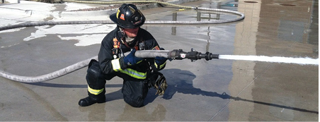  (2) By positioning his elbow against his raised leg, the firefighter increases his ability to resist the nozzle reaction forces.