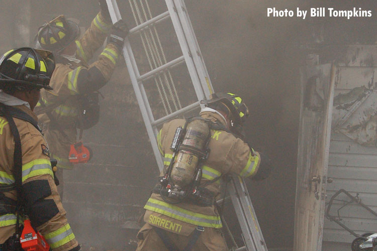 Firefighters operate at a house fire