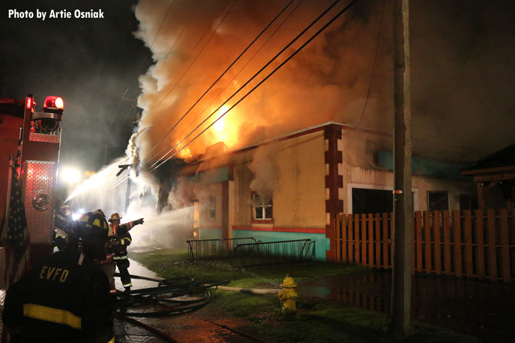 Firefighters working at scene of commercial fire