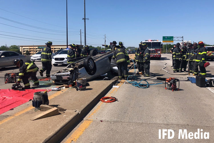 Firefighters at a vehicle rescue scene