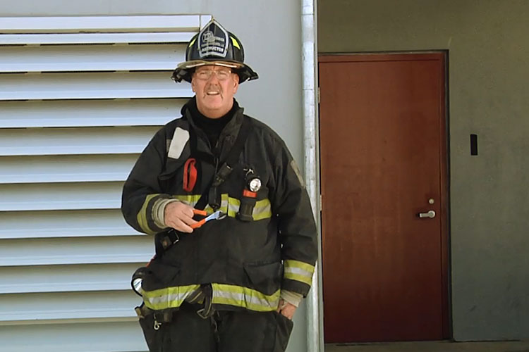 John Simpson with firefighting tools