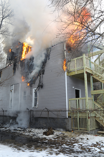 (7) Knockdown appears on the second floor, but there is still heavy fire in the third floor and attic.