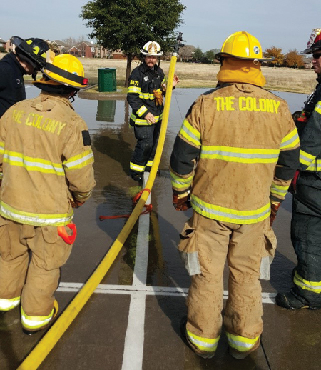 (1) Successful leaders are teachers. A battalion chief is training candidates on hose technique. (Photos courtesy of The Colony Fire Department.)