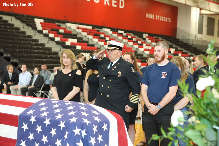 Fire official salutes casket of fallen Wisconsin firefighter