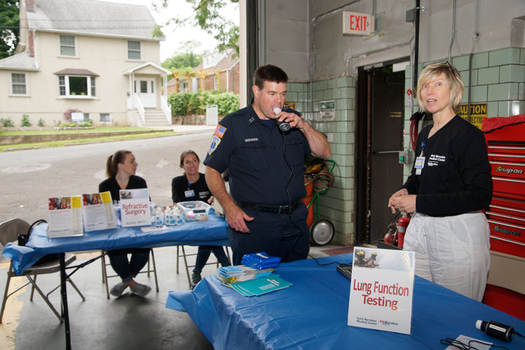 Firefighter taking a lung function test