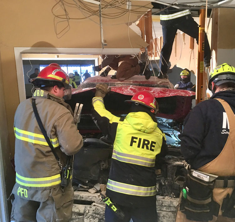 Pickup badly damages wall in vacant building