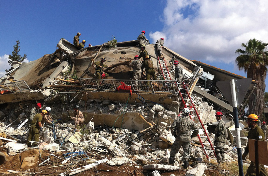 Members of the Israeli NRU; Indiana National Guard; United States Marine Corps Chemical, Biological, Radiological, and Nuclear Defense Team; and Indiana Task Force 1 conduct a search and extraction of a three-story dormitory during an international disaster drill of an earthquake in Lod, Israel