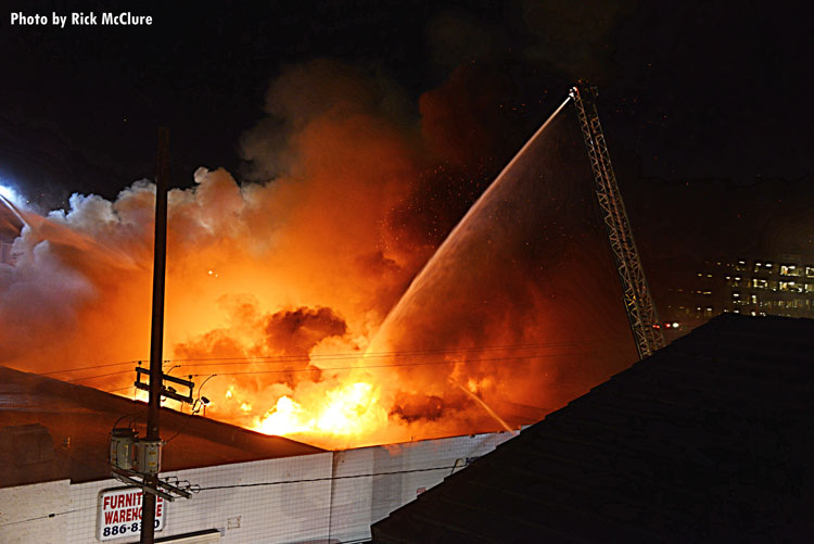 Fire streams training on burning building