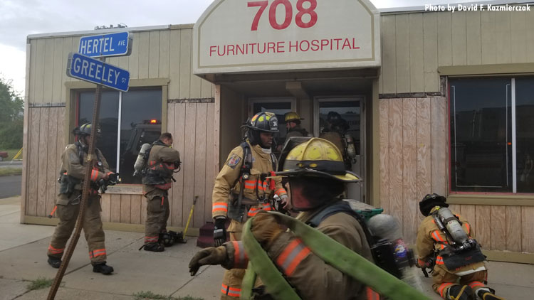 Firefighters at fire in commercial building