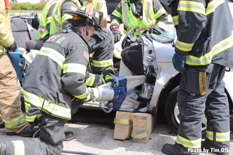 Firefighters perform extrication operations on a pin job in Illinois