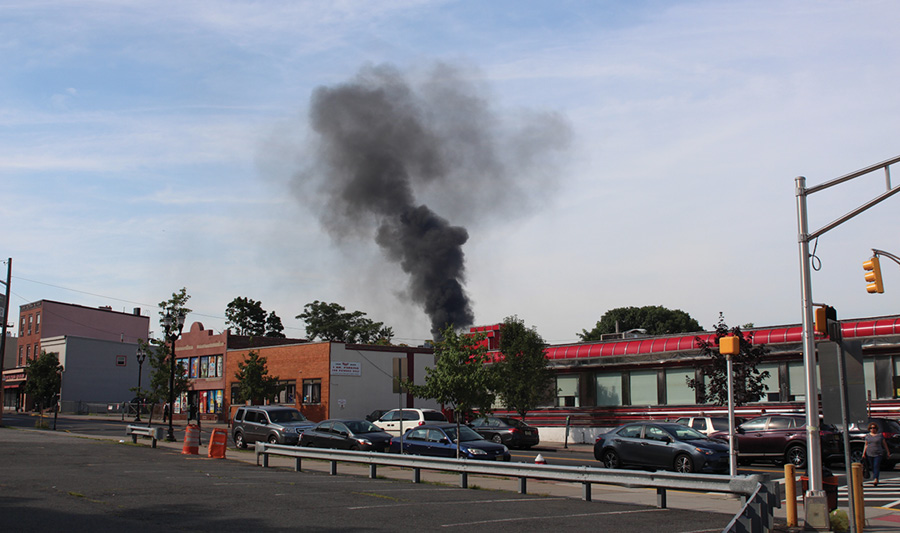 A large column of black smoke was seen in the distance as units responded, indicating a working fire. This, plus numerous calls received by dispatch, dictated a full-alarm assignment for a working fire.