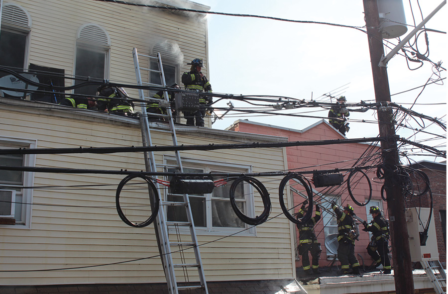 Additional ladders were raised to the second-floor roof of the fire building from the one-story bump-out on exposure D. This allowed for quick removal of the victims and space for additional victims.