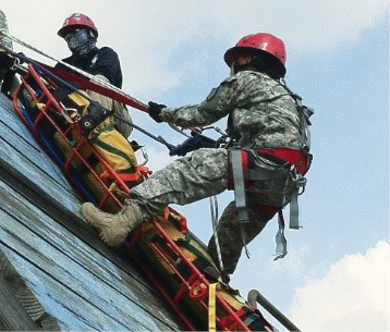 The rescuer on the basket is being hauled upward with a 3:1 Z-rig haul system. 