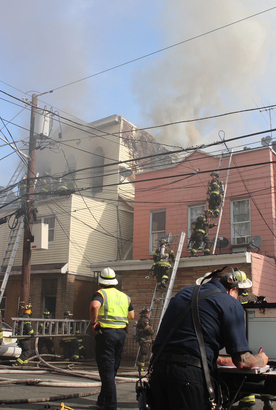 Because of overhead lines and their proximity to the fire building, all rescues had to be made using portable ladders or the interior stairs.