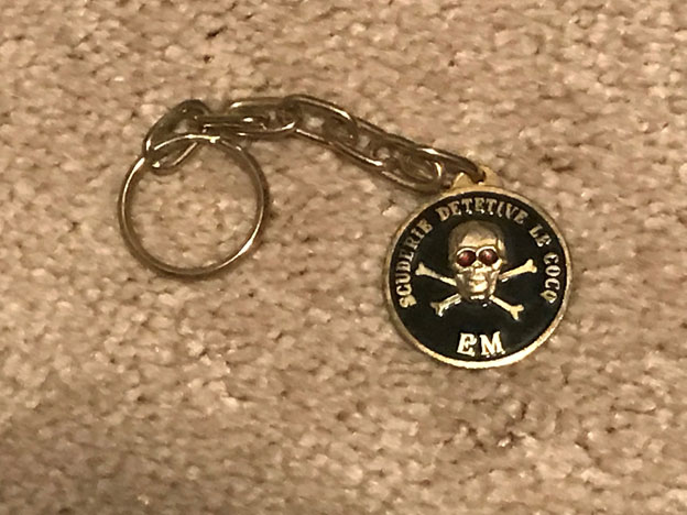 A keychain made by the militia / death squad Scuderie Le Cocq