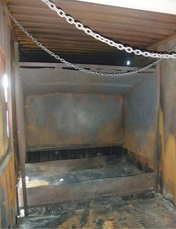 A hearth to protect the container roof and walls; the drawer below is to collect staples, nails, and debris that can be slid out to the left and dumped. (Photo by author.)