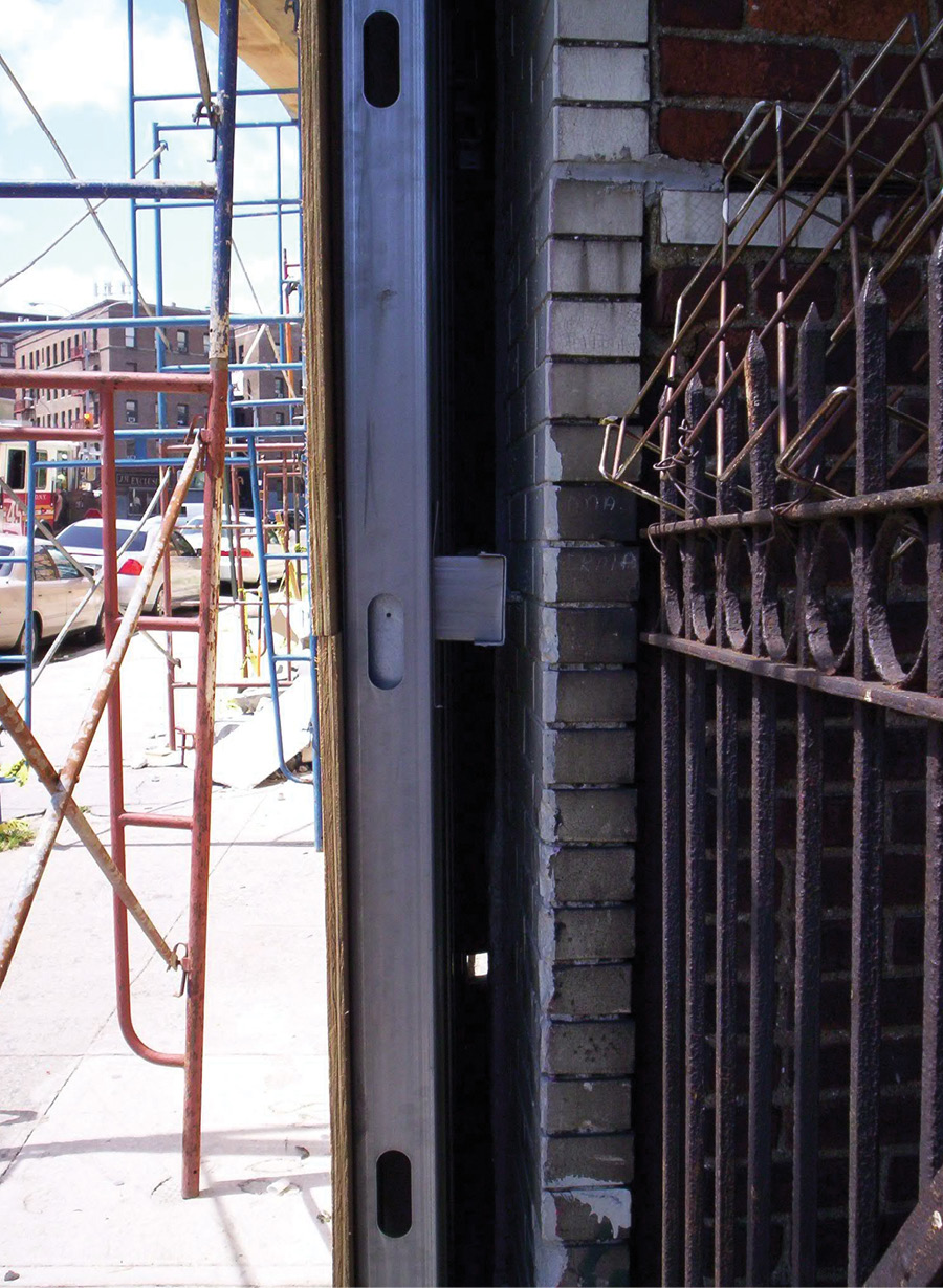 The attachment points are pieces of the metal stud, lagged into the brickwork and screwed into the studs. (Photos by J. J. Cassetta.) 