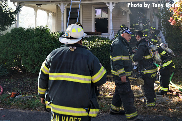 Firefighters work at the scene of a Waldwick fire