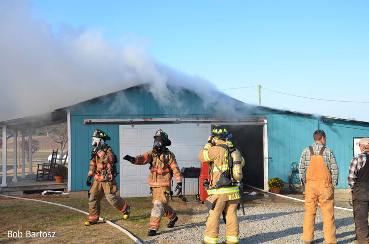 Firefighters outside a structure fire