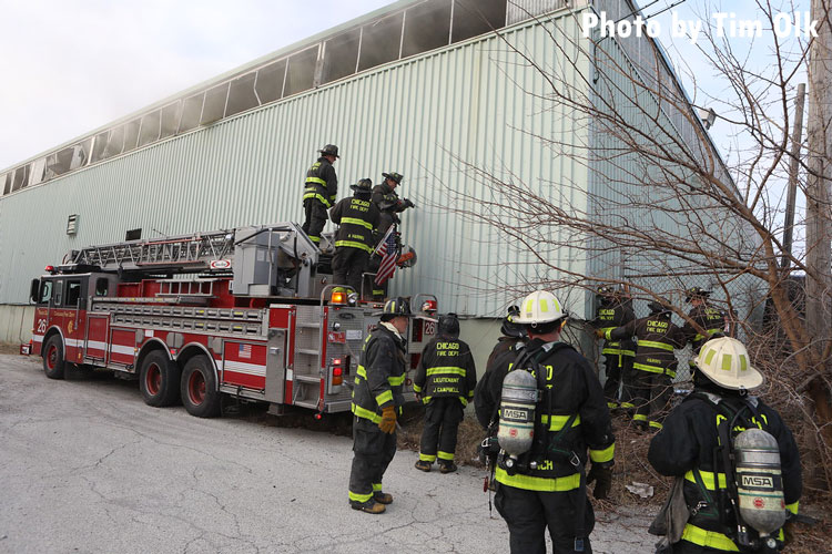 Chicago firefighter work to control a fire in a mattress factory