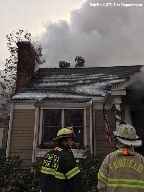 Firefighters perform roof ventilation