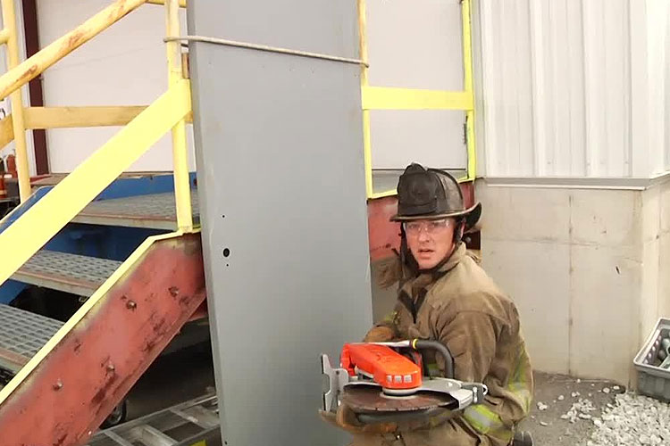 Mike Heeney holds a saw