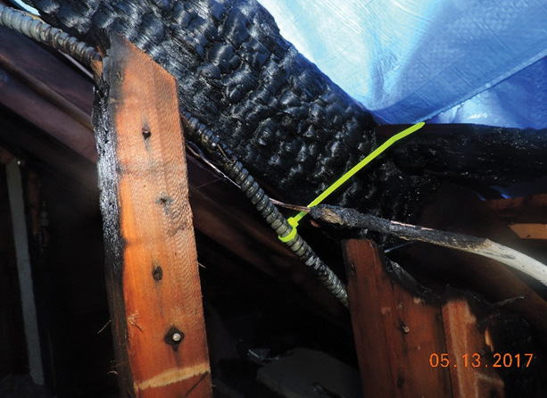 This short circuit caused a fire in a third-floor void in an occupied single-family home. The family had relatives visiting; they thought they smelled pancakes cooking. The armored cable had started to melt the spray insulation, resulting in “the pancake smell.”