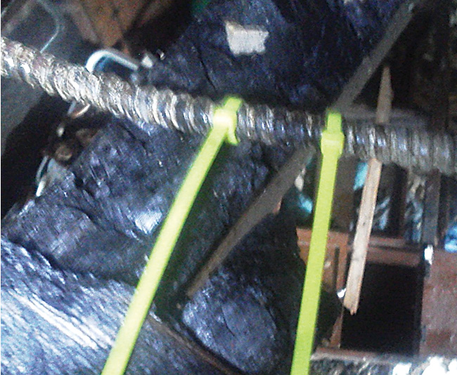 Plastic ties mark the areas where a blowout occurred, making the areas easy to identify in photographs. The blowout could be small and easily missed during the investigation. This blowout was found by slowly moving a bare hand over the armored cable.