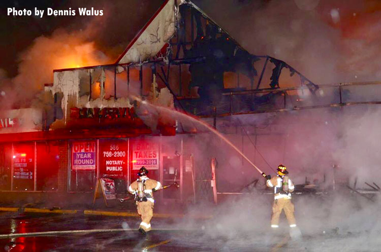 Firefighters at a strip mall fire