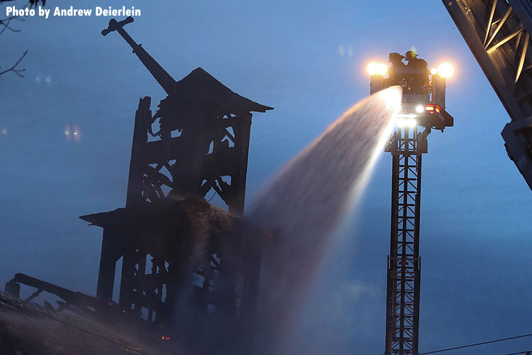 Tower ladders operating at scene of church fire