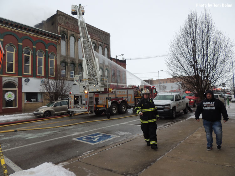 Tower ladder at downtown structure fire